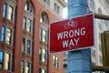 Red Wrong Way for bicycle direction traffic sign in Manhattan in New York City Royalty Free Stock Photo
