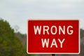 Red Wrong Way Sign on the Road