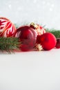 Red xmas ornaments on wooden background. Merry christmas card. Royalty Free Stock Photo