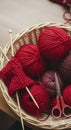 Red yarn balls in basket with knitting tools Royalty Free Stock Photo