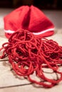 Red yarn, woolen string and beanie, knitting and crochet Royalty Free Stock Photo