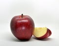 Red yellow apple with green leaf and slice Royalty Free Stock Photo