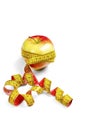 Red-yellow Apple with a measuring tape on Royalty Free Stock Photo