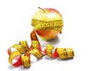 Red-yellow Apple with a measuring tape Royalty Free Stock Photo