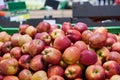 Red and yellow apples in the boxes in big grocery store. ripe apples Royalty Free Stock Photo