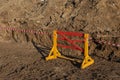 Red and yellow barriers blocking the road. Red White warning tape pole fencing is protects for No entry road Royalty Free Stock Photo