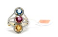 Red, yellow and blue Diamond with white diamond and gold ring Royalty Free Stock Photo
