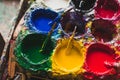 Red, yellow, blue and green colors for art painting in craftsman workshop