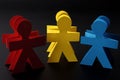 Red yellow and blue paper men Royalty Free Stock Photo