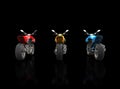 Red, Yellow and Blue sports motorcycles - back view