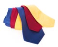 Red yellow and blue ties. silk business tie rolled up over white background Royalty Free Stock Photo