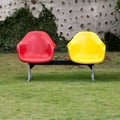 Red and yellow chair in garden
