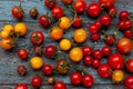 Red and yellow cherry tomatoes top view. Harvest vegetables. Tomato on the table. Vitamin healthy food. Rustic kitchen Royalty Free Stock Photo
