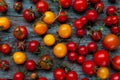 Red and yellow cherry tomatoes top view. Harvest vegetables. Tomato on the table. Vitamin healthy food. Rustic kitchen Royalty Free Stock Photo