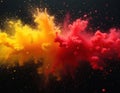 Red, yellow colored powder exploding against black background. Abstract, dynamic image of vibrant colors mixing, spreading.