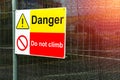 Red and yellow danger, do not climb warning sign for electricity Royalty Free Stock Photo