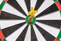 Red and yellow dart arrows hitting in the target center of dartboard. Success hitting target aim goal achievement concept Royalty Free Stock Photo