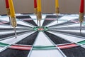 Red and yellow dart arrows hitting in the target center of dartboard. Success hitting target aim goal achievement concept Royalty Free Stock Photo