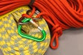 Red and yellow dynamic ropes and attached carabiner.
