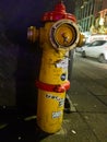 Red and yellow fire hydrant in the city centre of Reykjavik, Iceland. Royalty Free Stock Photo