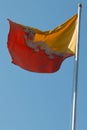 The red and yellow flag of Bhutan flying over Punakha dzong, Bhutan