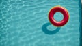 Red and yellow float in crystal clear pool water, epitomizing summer fun, AI-generated. Royalty Free Stock Photo