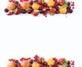 Red and yellow fruits on white background. Ripe apricots, red currants, cherries and strawberries. Sweet and juicy fruits at bord Royalty Free Stock Photo