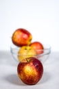 Red Yellow Gala Apple in Front of Glass Fruit Bowl