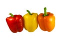 Red, yellow and green bell pepers in row