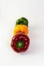Red yellow and green bell pepper staggered in line like traffic lights Royalty Free Stock Photo