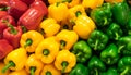 Red, yellow, and green bell peppers (capsicum) background Royalty Free Stock Photo