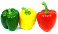 Red, yellow and green peppers, traffic light colours isolated on white background Royalty Free Stock Photo