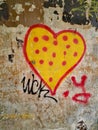 Heart in a pea on a wall. Symbol of love. Graffiti.