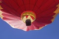 Red and Yellow Hot Air Balloon Against a Blue Sky Royalty Free Stock Photo