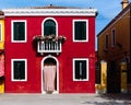 Red and yellow houses on the colorful island of Burano, Venice,