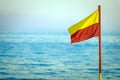 Red and yellow life saving flag Royalty Free Stock Photo