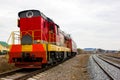 Red-yellow locomotive train on the tracks Royalty Free Stock Photo