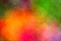 Red, yellow, magenta, green multi colored cloudy background