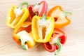 Red, yellow and orange bell pepper halves