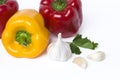 Red yellow and orange peppers on a white background. Multicolored vegetables in a composition on a white background. Royalty Free Stock Photo