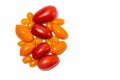 Red, yellow and orange plum-shaped tomatoes on a white background. Isolated Royalty Free Stock Photo