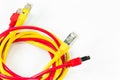 Red and yellow patch cables with RJ45 connector isolated on whit Royalty Free Stock Photo