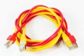 Red and yellow patch cables with RJ45 connector isolated on whit Royalty Free Stock Photo