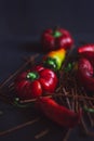 red and yellow pepper on on a black background. Royalty Free Stock Photo