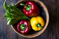 Red and Yellow Pepper with Green Runner Beans in Wooden Basket. Royalty Free Stock Photo