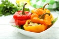 Red and yellow peppers stuffed with the meat, rice and vegetables