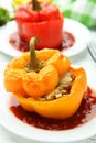 Red and yellow peppers stuffed with the meat, rice and vegetables Royalty Free Stock Photo