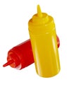 Red and yellow plastic ketchup and mustard bottles Royalty Free Stock Photo