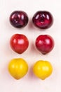 Red, yellow plum fruit top view on the white background Royalty Free Stock Photo