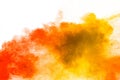 Red yellow  powder explosion on white background.Red yellow color dust splash clouds Royalty Free Stock Photo